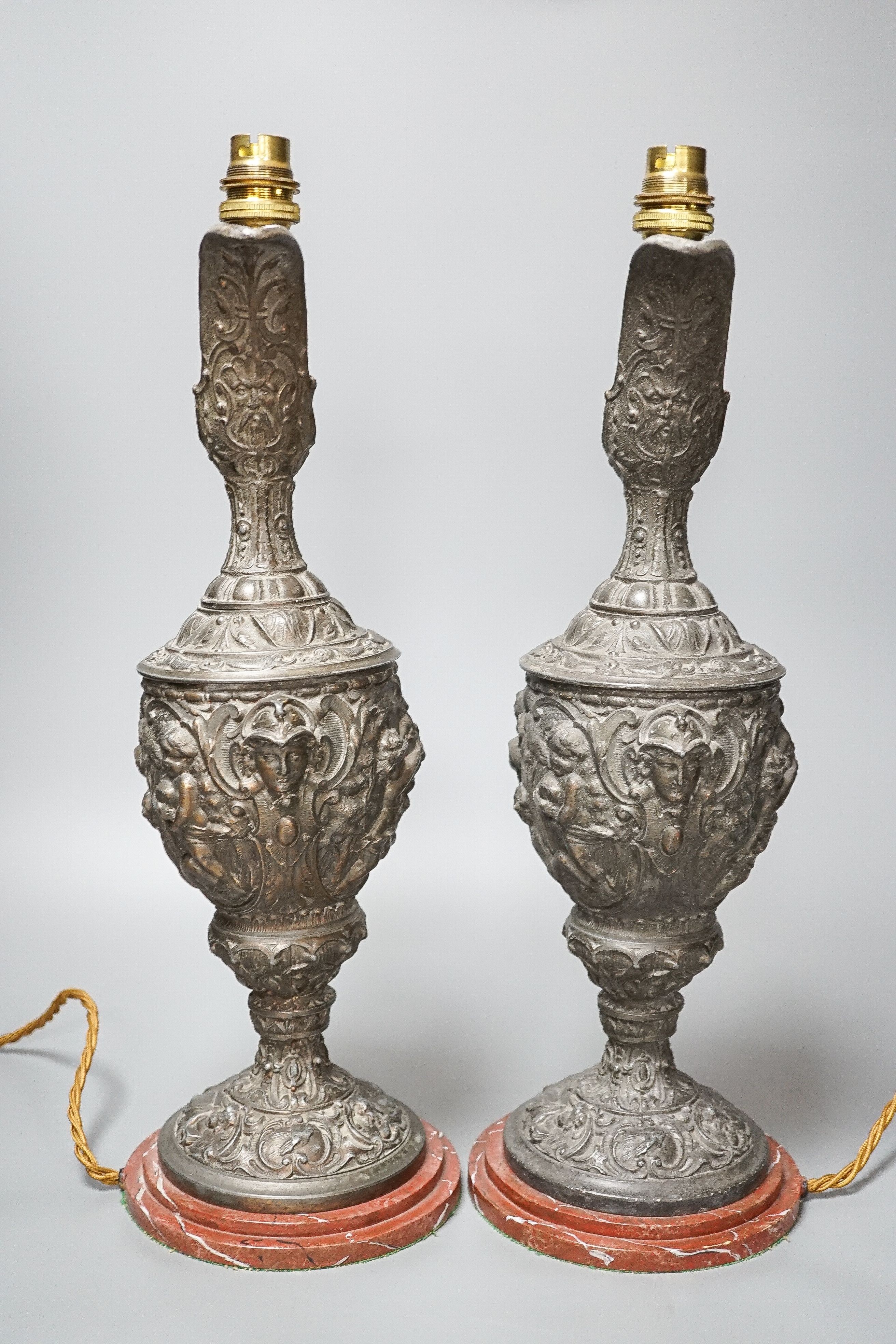 A pair of early 20th century spelter ewers mounted as lamps 42cm